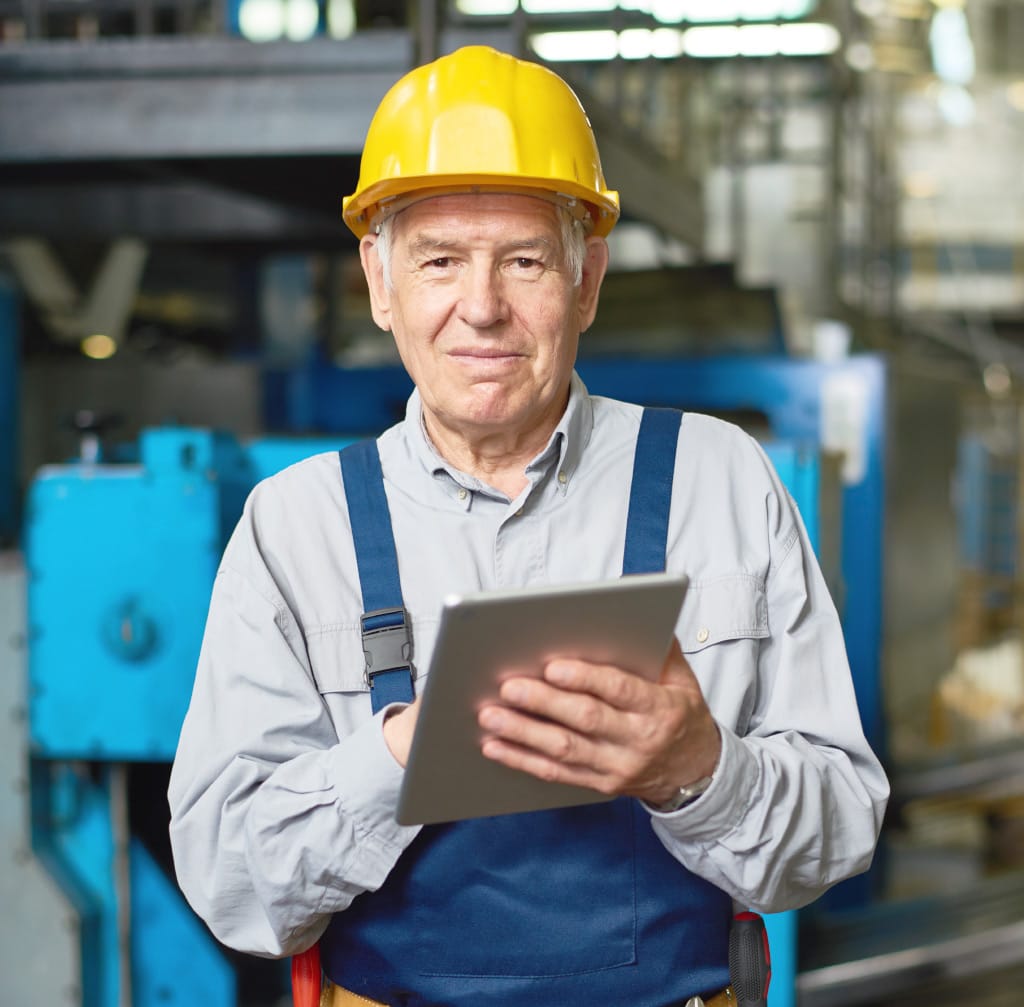 senior man working at modern factory TNQ8KU3